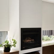 The fireplace in the living area opposite the 