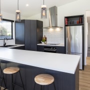 The kitchen includes a breakfast bar, a prep 