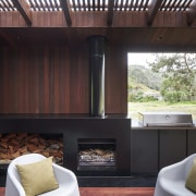 The sheltered outdoor room with integrated BBQ and 