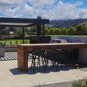 The patio connects with the sprawling country  garden 