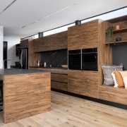 The substantial timber kitchen cabinetry is matched with 