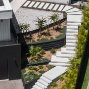 A cascade of white mid-century concrete steps takes 