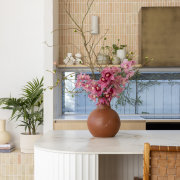 Kitchen island with breakfast seating and fluted finish. 