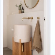 Powder room by the front entry. - Stretching 