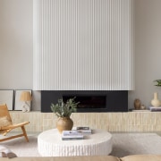 Fluting on the fireplace echoes a similar finish 