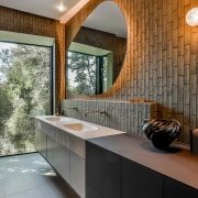 Spatially, a full-height picture window at the edge 