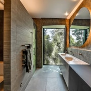 The toilet is tucked away from the main 