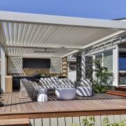Horizontal slats enhance privacy while the timber grain 
