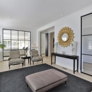 The formal living room with the custom glass 