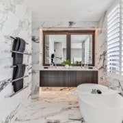 Nothing says luxurious like wall-to-wall-to-floor marble. 