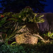 Uplighting adds atmosphere to this Balinese-look sculpture. 