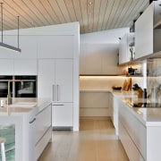 Island front and splashback are exotic counterpoints to 