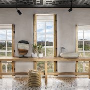 The bathroom combines contemporary materials such as terrazzo 