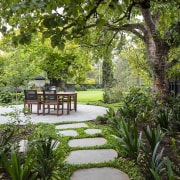 Stepping stones lead to the serene seating/entertaining area. 