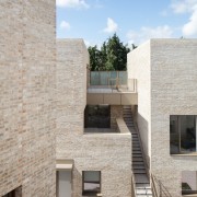 This low-rise, high-density development reflects a sensitive massing 