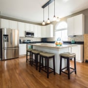 The kitchen floor is one of the most cabinetry, countertop, cuisine classique, floor, flooring, hardwood, interior design, kitchen, laminate flooring, real estate, room, wood, wood flooring, white