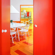 “The colours are addictive. Now that we know architecture, building, door, floor, furniture, house, interior design, line, material property, orange, property, red, room, table, wall, yellow, red, orange