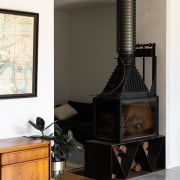 Wood fire in keeping with the renovated home's 