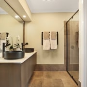 His and her sinks sit beneath a large bathroom, floor, home, interior design, product design, room, sink, gray