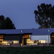 This night shot shows the expansive windows - architecture, barn, cottage, evening, facade, farmhouse, home, house, property, real estate, residential area, roof, shed, sky, blue, black