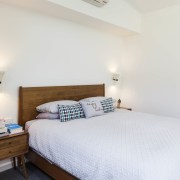 The bedroom features spacious ceilings - The bedroom bed, bed frame, bedroom, furniture, home, property, real estate, room, wood, white
