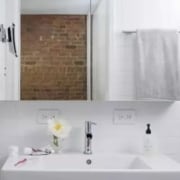 One clever trick is to use the same bathroom, bathroom accessory, bathroom cabinet, floor, home, interior design, plumbing fixture, property, room, sink, tap, wall, gray