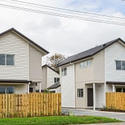 Eight new homes in the Richardson-Howell development, owned building, cottage, facade, farmhouse, home, house, neighbourhood, property, real estate, residential area, siding, suburb, white