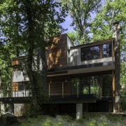 The home sited in an idyllic forest setting architecture, building, cottage, home, house, property, real estate, tree, brown, black