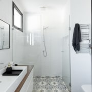 This bathroom manages to pack in all the bathroom, bathroom accessory, home, interior design, product design, property, real estate, room, sink, white