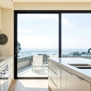 Most rooms capture breathtaking sea views - Most architecture, countertop, daylighting, house, interior design, kitchen, property, real estate, window, white