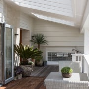 A sheltered outdoor room is a great place ceiling, daylighting, deck, floor, hardwood, home, house, interior design, laminate flooring, living room, outdoor structure, patio, porch, real estate, roof, siding, window, gray