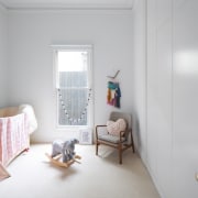 A large window looks out to the fence ceiling, daylighting, floor, flooring, home, house, interior design, living room, property, real estate, room, wall, window, wood, gray