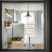 In the kitchen, a wood countertop creates a home, home appliance, interior design, window, black, gray