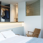 The bedroom features recessed lighting, meaning the room architecture, bed frame, bedroom, ceiling, furniture, home, interior design, room, suite, wall, white