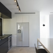 Another view of the kitchen - Another view architecture, countertop, floor, house, interior design, kitchen, real estate, gray, white