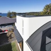 You can certainly get a sense of the architecture, cottage, daylighting, facade, home, house, outdoor structure, property, real estate, roof, shed, black