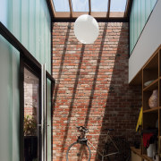 This skylight brings the outside in - This apartment, architecture, building, ceiling, daylighting, home, house, interior design, roof, structure, window, gray, black