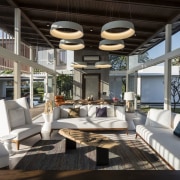 This shaded outdoor area is the perfect place interior design, living room, real estate, gray, black