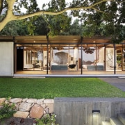 The tidy grounds perfectly match the home - architecture, backyard, courtyard, house, outdoor structure, real estate, gray