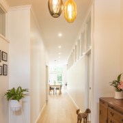 A light arrangement in the hallway - A ceiling, daylighting, floor, flooring, hardwood, home, interior design, lighting, living room, molding, real estate, room, wall, window, wood, wood flooring, orange, white