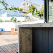 A concrete bench means a strong, sturdy workspace architecture, balcony, home, house, interior design, property, real estate, wall, window, white