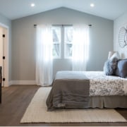 A view of the bedroom from the far bed frame, bedroom, ceiling, floor, flooring, home, interior design, real estate, room, wall, window, wood, gray