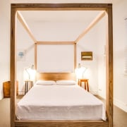 The bedroom – located in the older part bed, bed frame, bedroom, ceiling, daylighting, floor, furniture, home, interior design, real estate, room, suite, window, wood, white