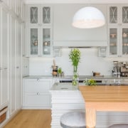 The layered island is certainly an interesting touch cabinetry, ceiling, countertop, cuisine classique, floor, home, interior design, kitchen, room, wall, window, gray