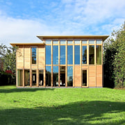 The home has a stately presence - The architecture, cottage, elevation, estate, facade, farmhouse, grass, home, house, property, real estate, green, teal