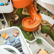The vibrant, spiral staircase in the atrium of white