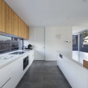 This large kitchen has a unique splashback  architecture, countertop, house, interior design, kitchen, real estate, gray