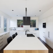 Bar seating within the kitchen itself means the architecture, countertop, house, interior design, kitchen, product design, real estate, room, white