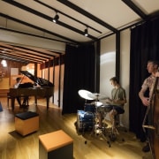 A studio space was one of the requested interior design, music, musical instrument, musical instrument accessory, session musician, studio, brown, black