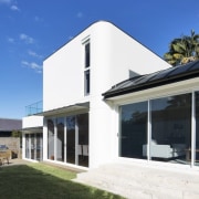 Another view of the yard and living area architecture, elevation, facade, home, house, property, real estate, residential area, roof, window, blue, black, white